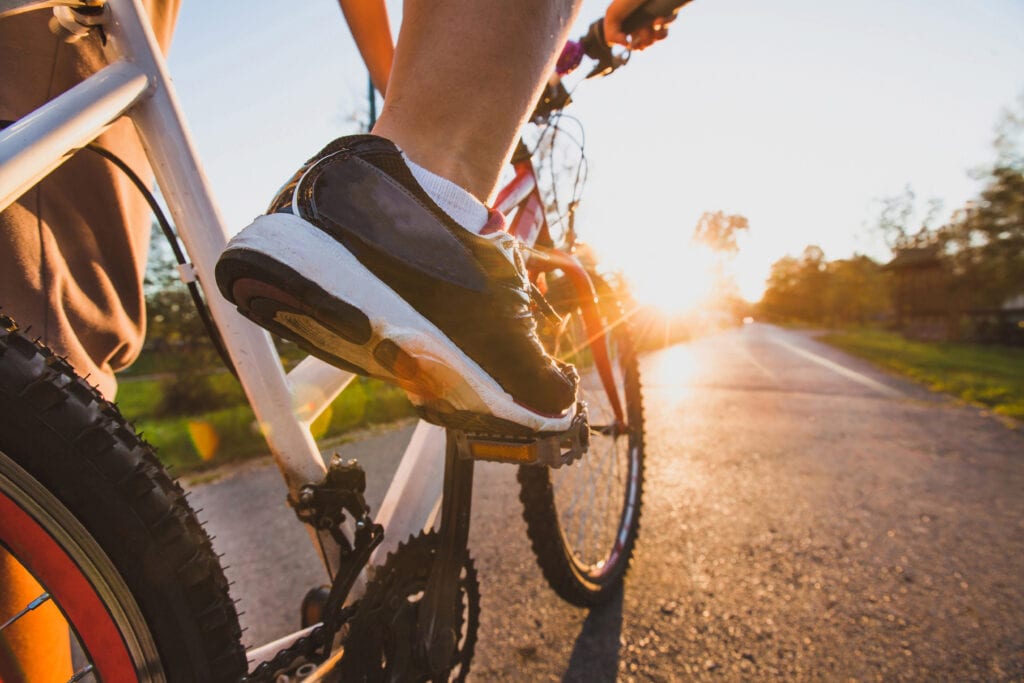 up close foot on bike pedal stay active spring